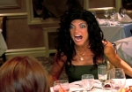 Teresa from the Housewives of New Jersey flipping a table screaming Prostitution Whore!